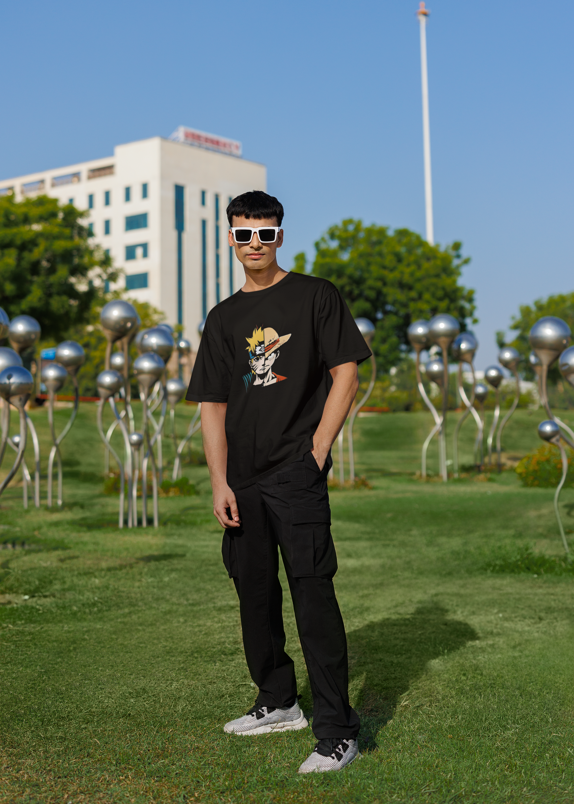 Model wearing W.I.F.I Men's Oversized One Piece Anime Inspired Graphic T-Shirt in a casual setting.