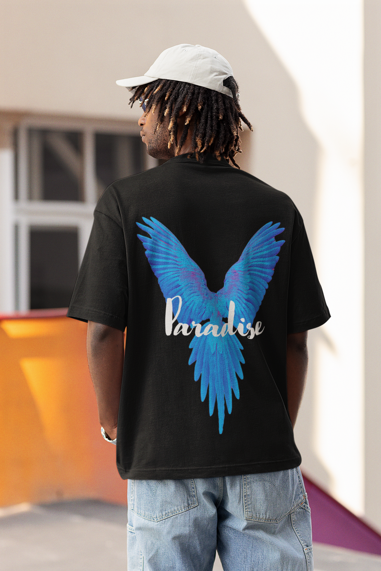 Back view of W.I.F.I Men's Oversized "Paradise Blue Wings" Graphic Premium Cotton Black T-Shirt