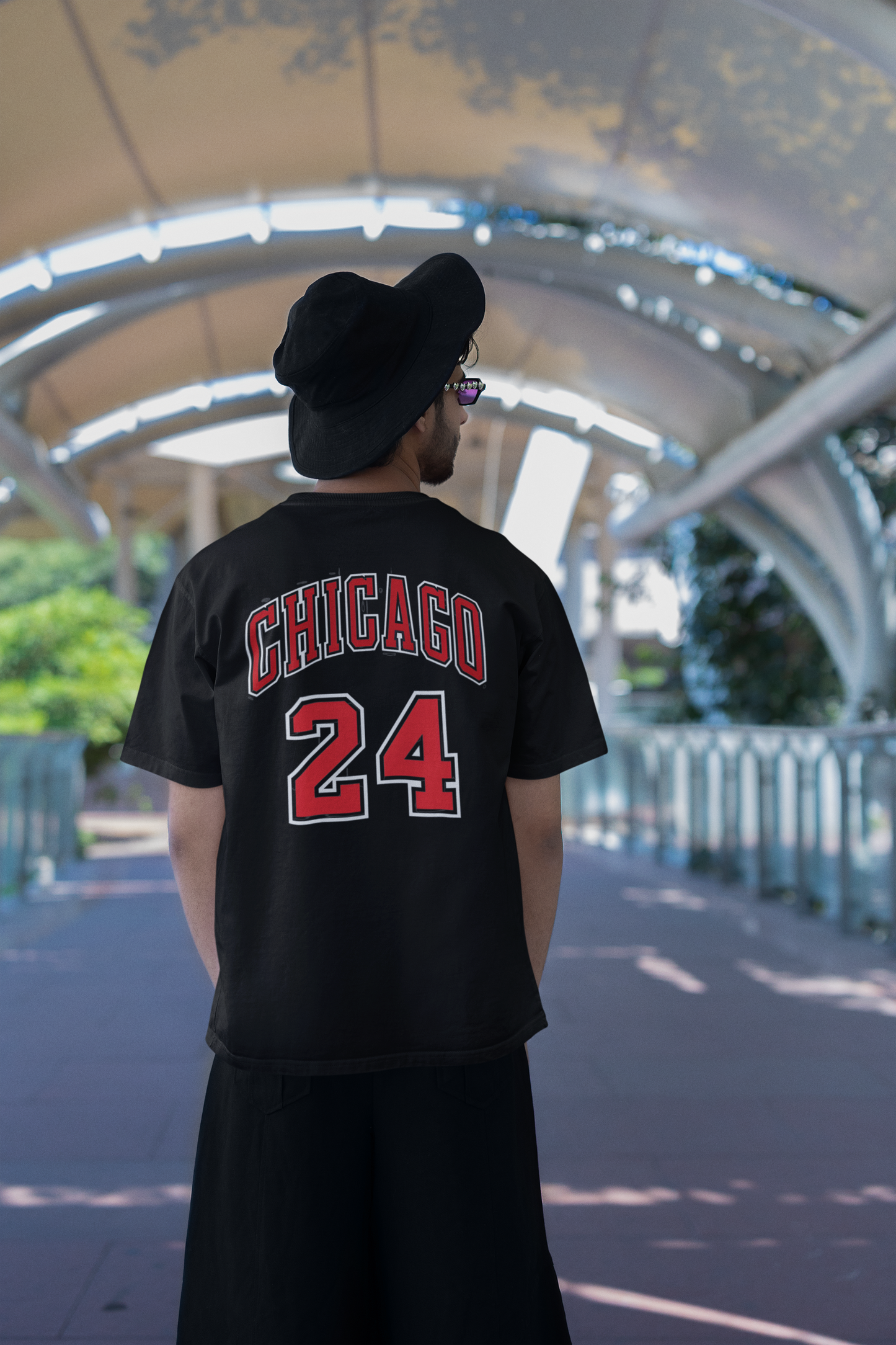 W.I.F.I Men's Oversized "CHICAGO Typography" T-Shirt modeled by a man outdoors