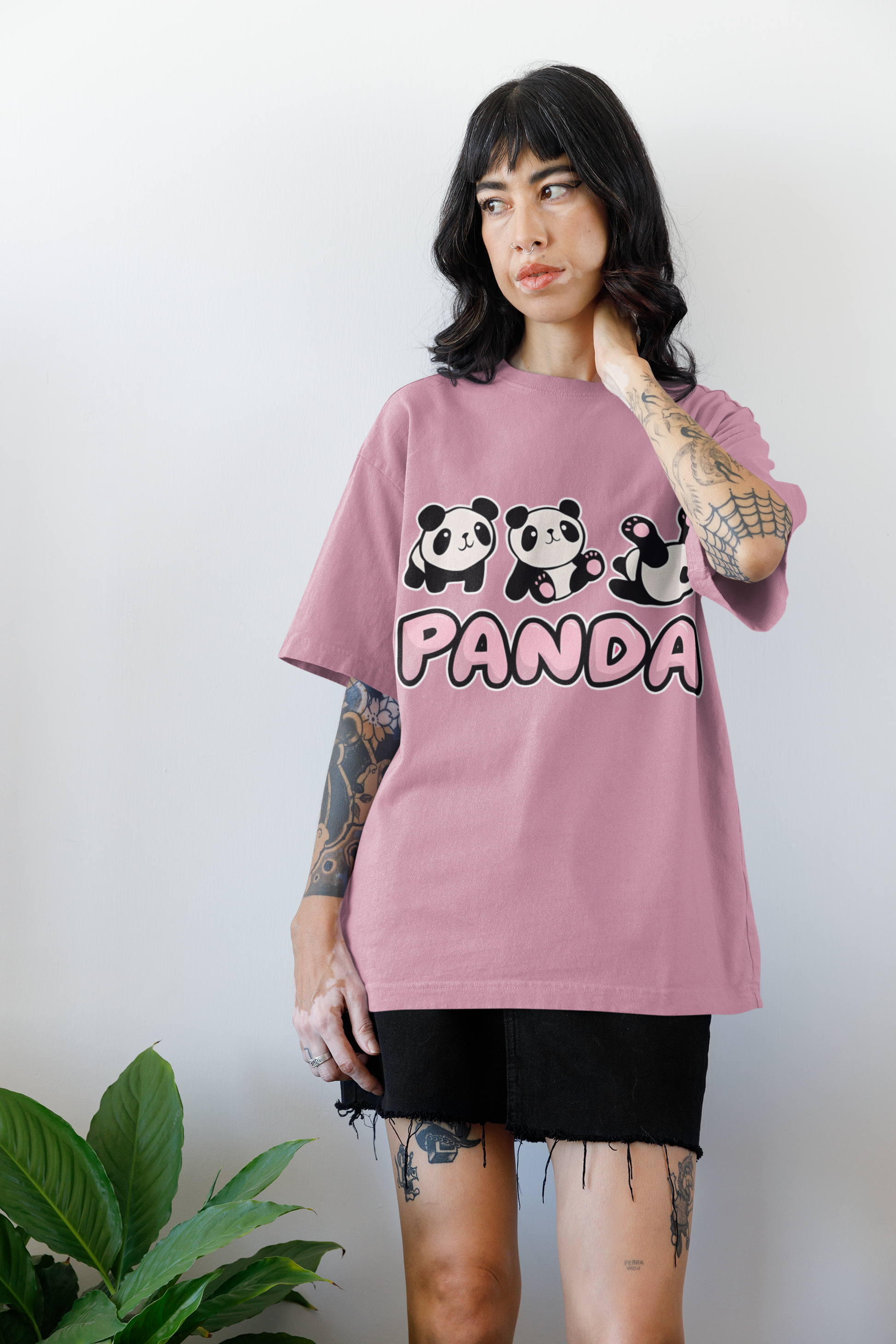 Model wearing W.I.F.I Women's Oversized "Panda" Quote Graphic T-Shirt in Flamingo pink